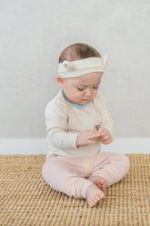 Newborn girl in Avauma Vanilla Sky ribbed pajama – cozy baby sleepwear for girls